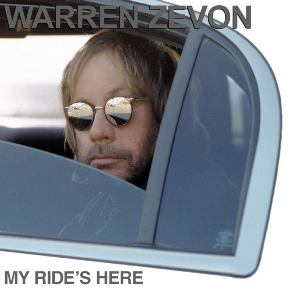 Album Cover from My Ride's Here, showing Zevon peering out of the window of a limo